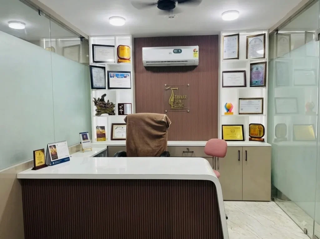 Consultation desk and wall display of medical certificates and awards at Tanwar Skin Clinic.